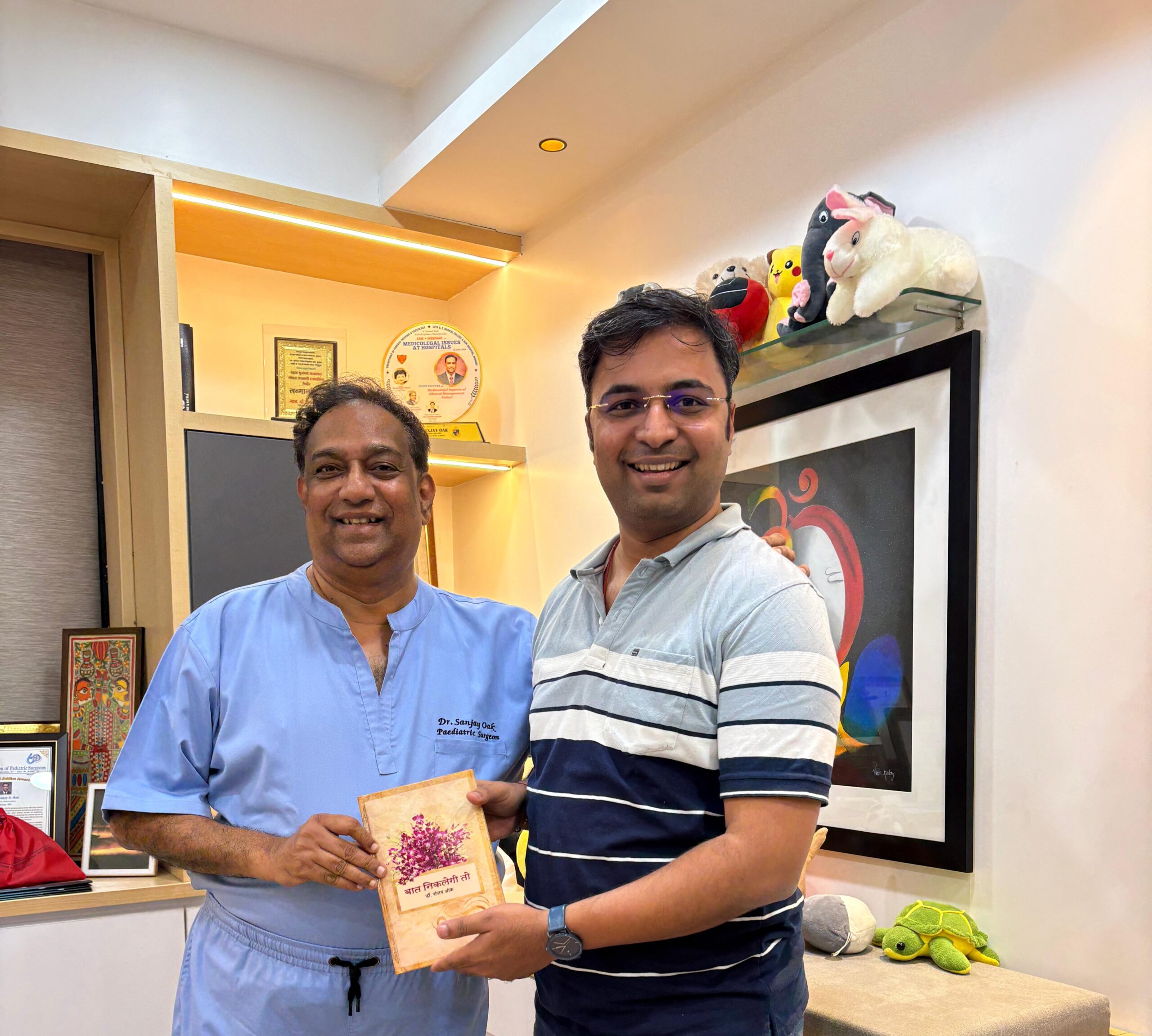 10. Dr Amey Desai _ handed new book to him